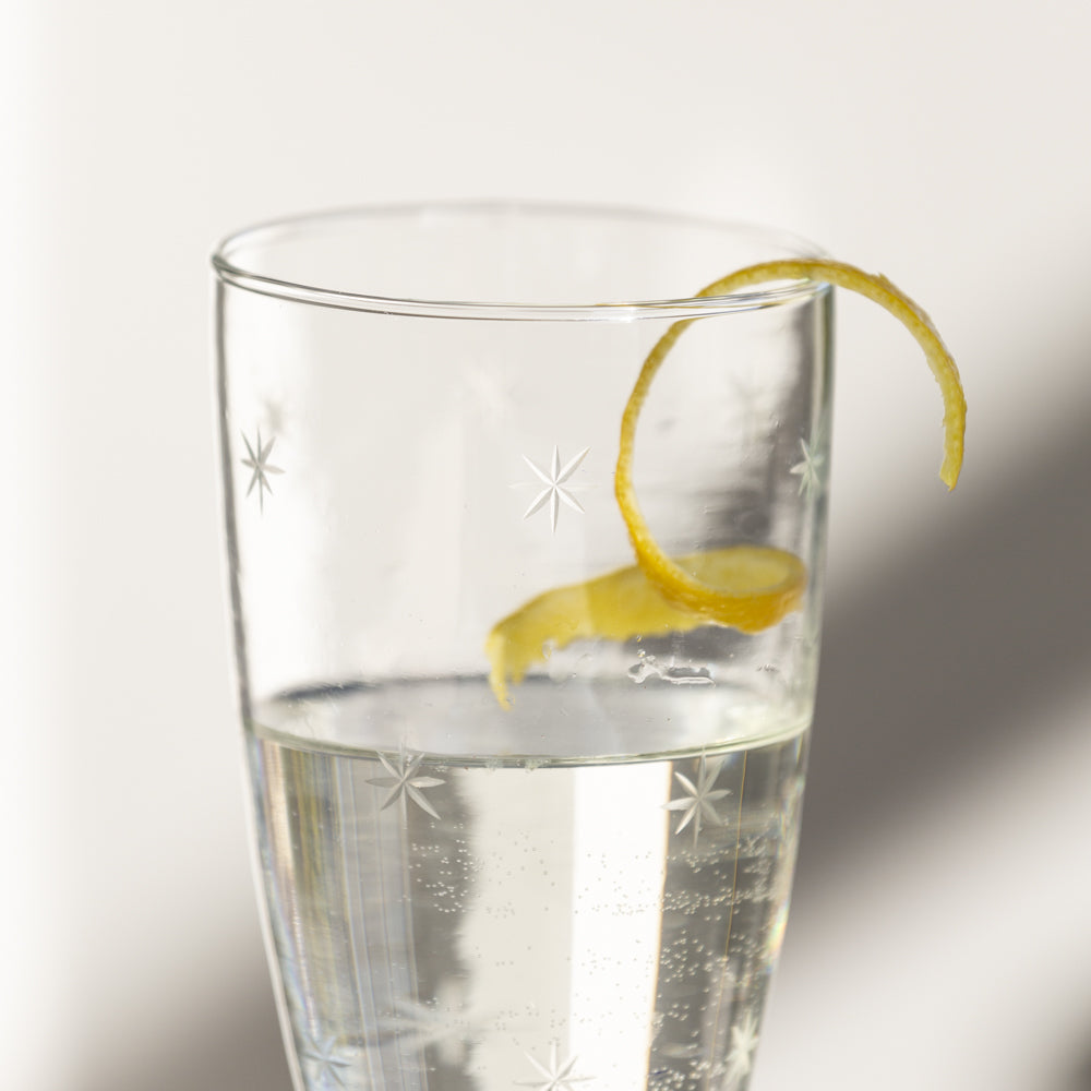 Etched star champagne glass